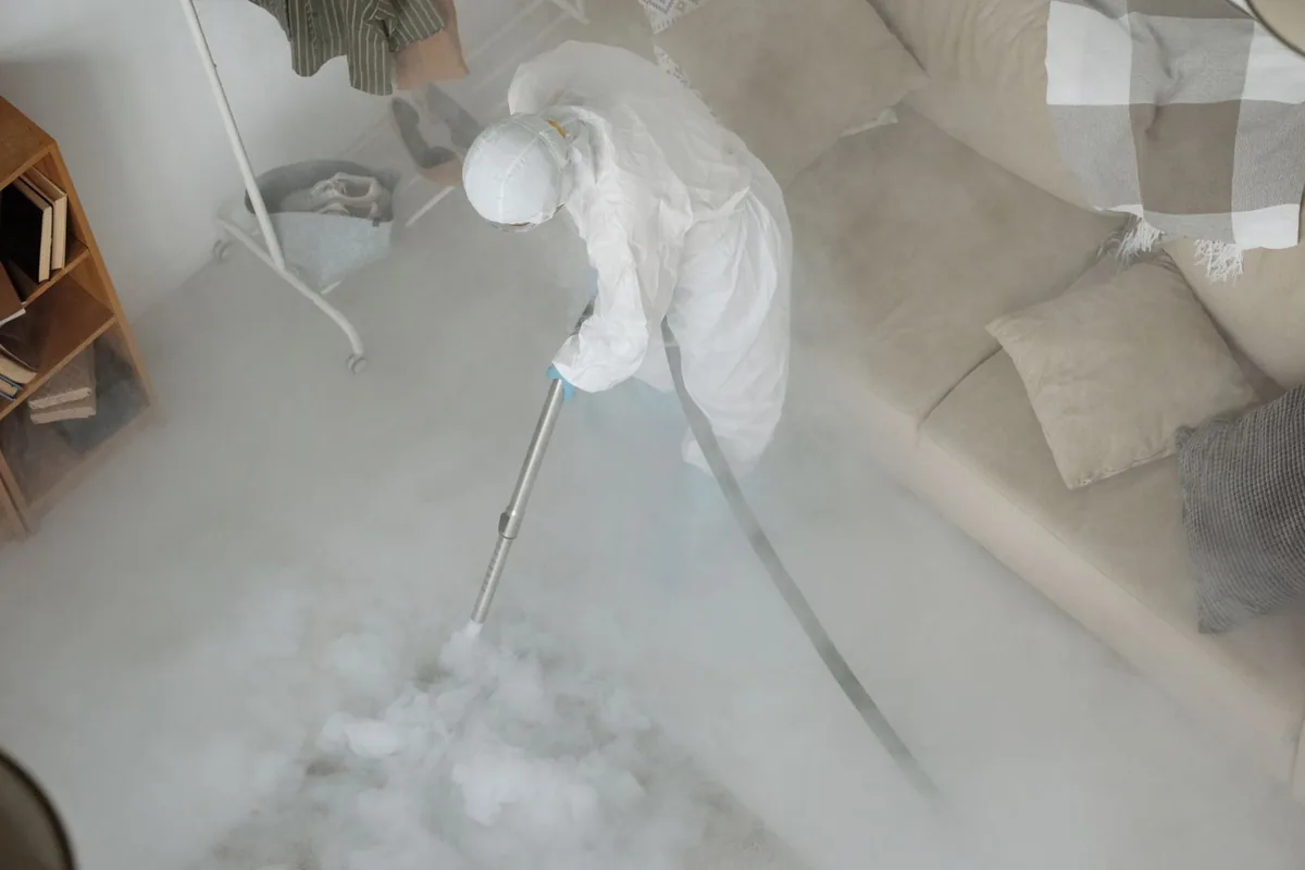 Biohazard cleanup technician in protective equipment, New Preston, CT